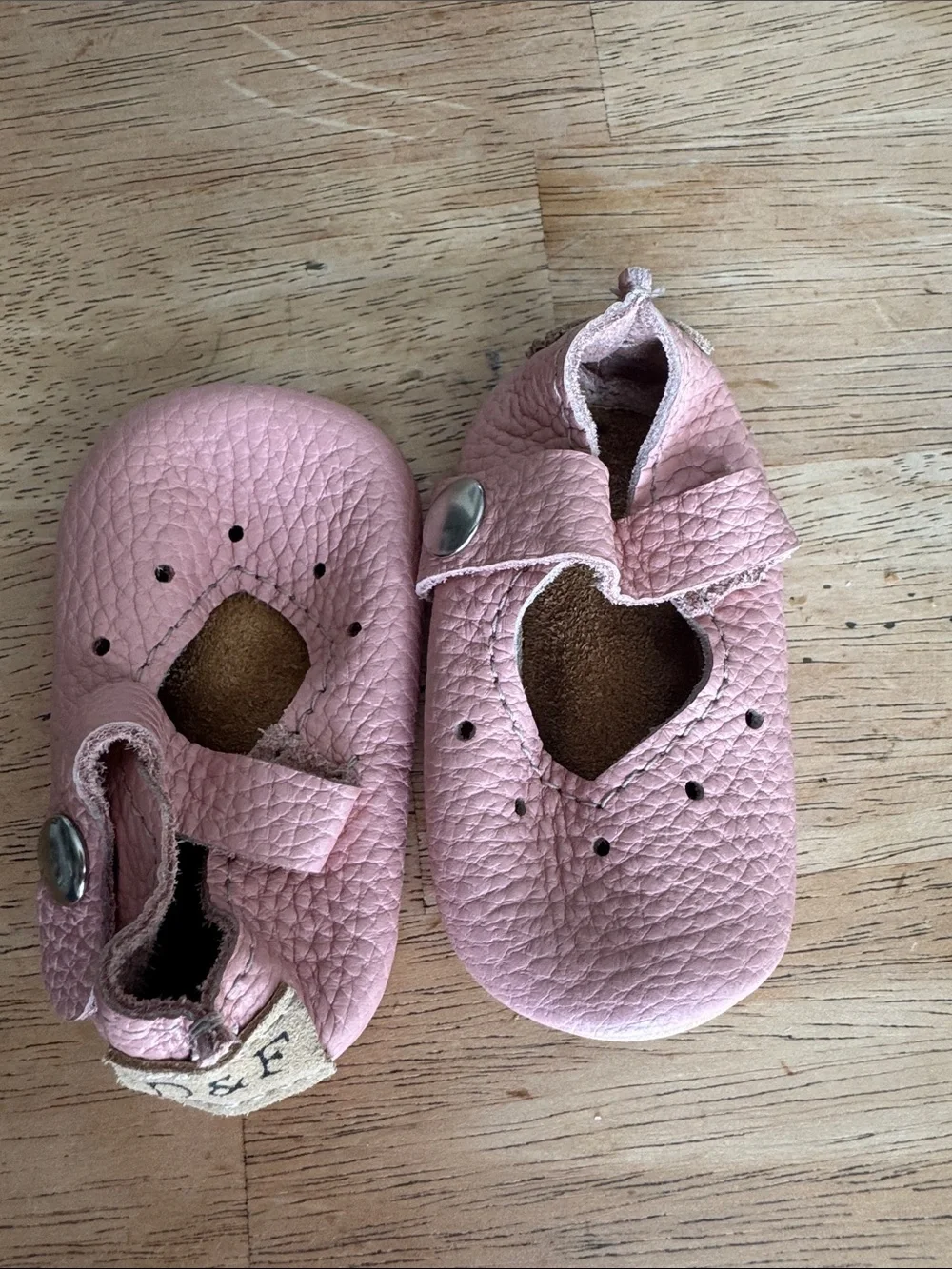 Duchess & Fox soft pink infant shoes.